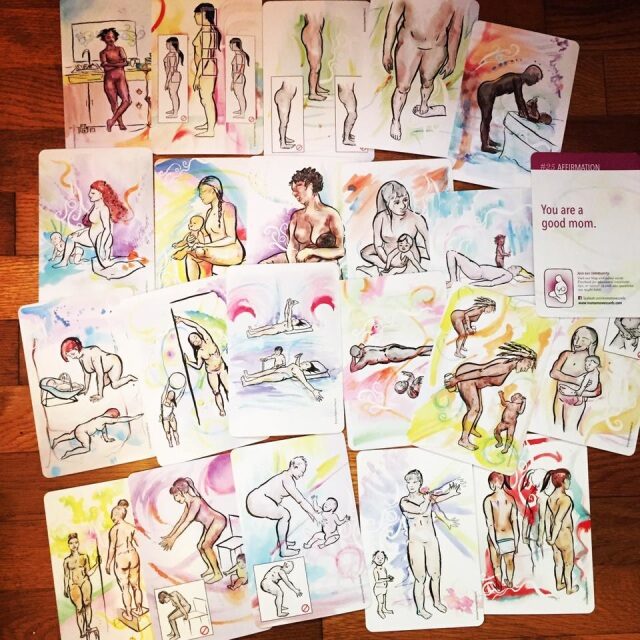 All 29 Mama Moves Cards spread on a wooden floor